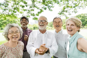 a family smiling with dental implants